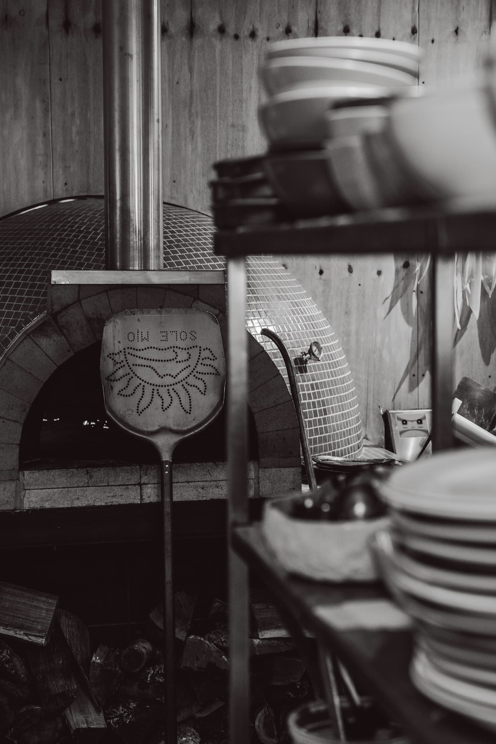 Plates stacked by the oven